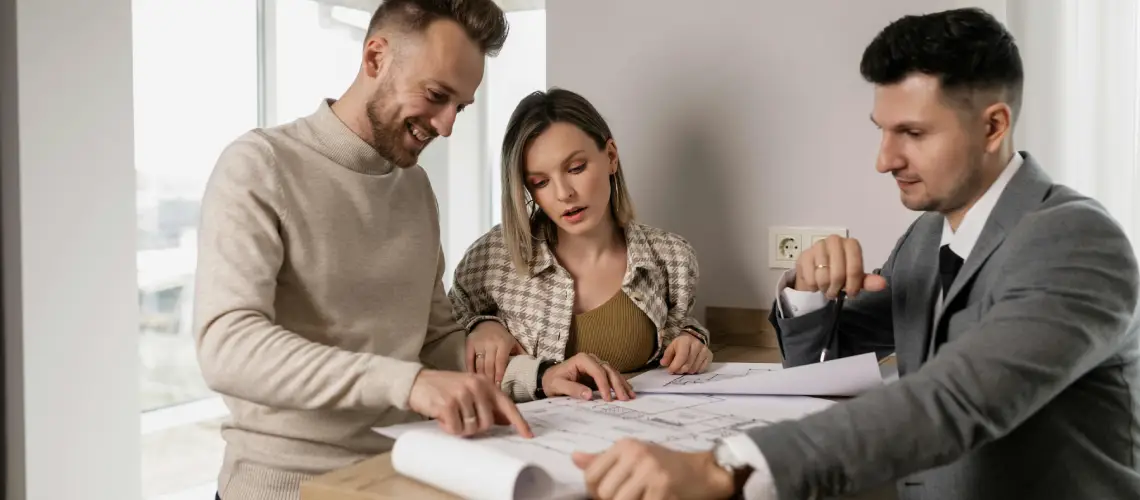 Young couple reviewing a property valuation report with a licensed valuer in Australia